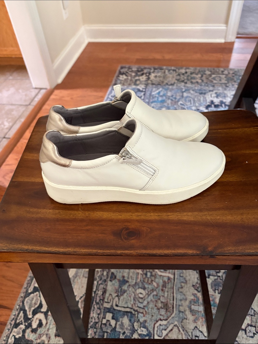 Clarks White Leather Slip-On Sneakers with gold Metallic Heel Accent